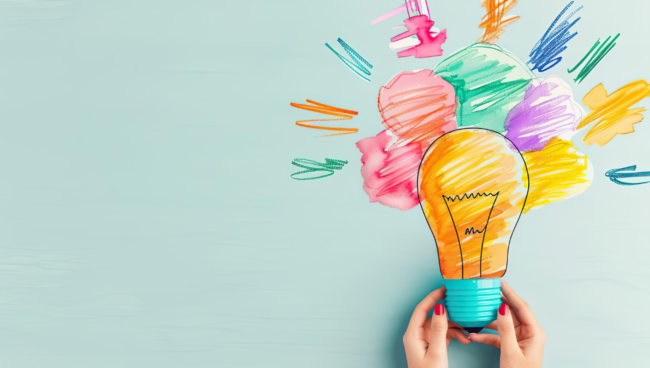 Creative concept illustration with colorful lightbulb held by hands, symbolizing innovation and bright ideas from A&C Enterprises.