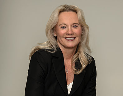 Carolyn Herrera of A&C Enterprises in a black blazer, smiling confidently against a neutral background, representing leadership and business expertise. Carolyn Herrera of A&C Enterprises in a black blazer, smiling confidently against a neutral background, representing leadership and business expertise.